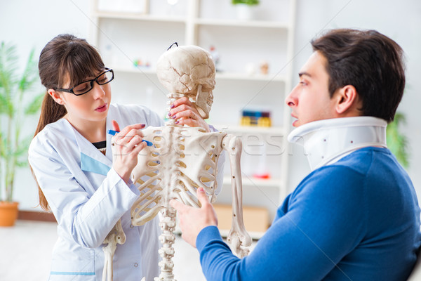 Doctor is explaining to patient with neck injury Stock photo © Elnur