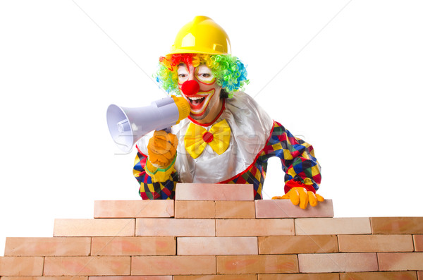 Bad construction concept with clown laying bricks Stock photo © Elnur