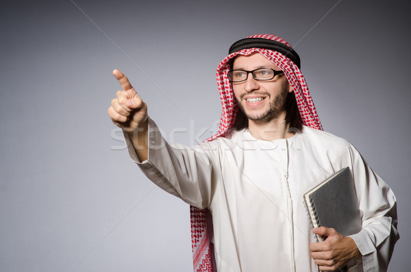 Arab man pressing virtual button Stock photo © Elnur
