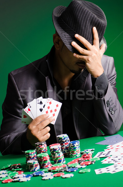 Homme jouer sombre casino vert costume [[stock_photo]] © Elnur