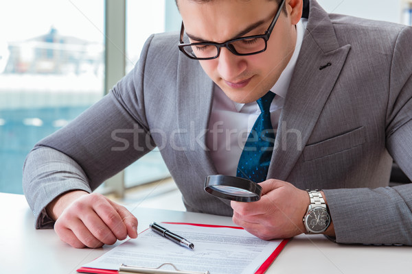 Man looking for errors and mistakes in report Stock photo © Elnur