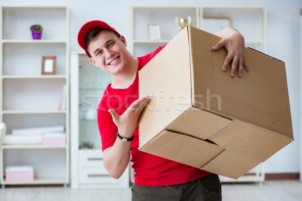 Post man delivering a parcel package Stock photo © Elnur