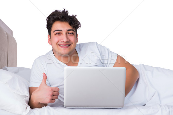 Férfi ágy szenvedés álmatlanság internet boldog Stock fotó © Elnur