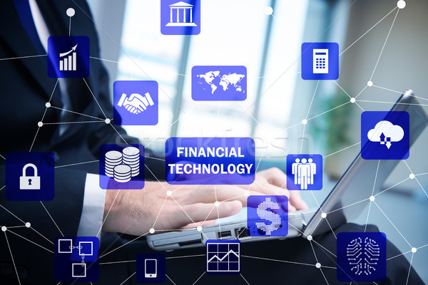 Hands working on laptop in financial technology fintech concept Stock photo © Elnur