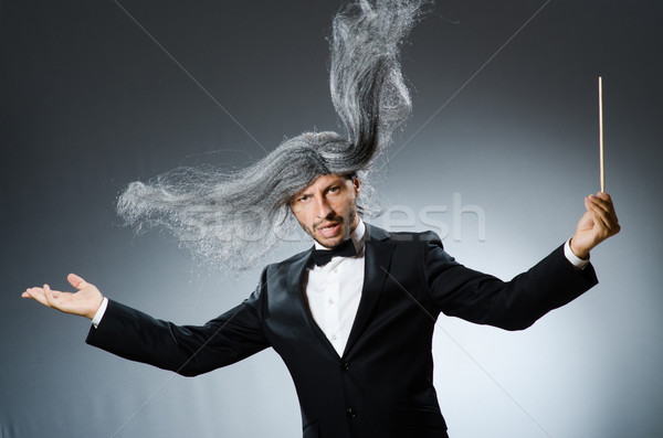 Funny conductor with long grey hair Stock photo © Elnur