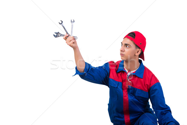 Stock photo: Young repairman with wrench spanner isolated on white