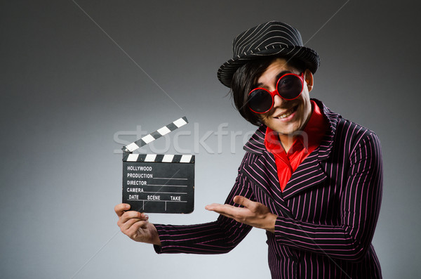Funny man with movie board Stock photo © Elnur
