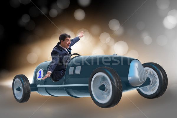 Businessman riding vintage roadster in motivation concept Stock photo © Elnur