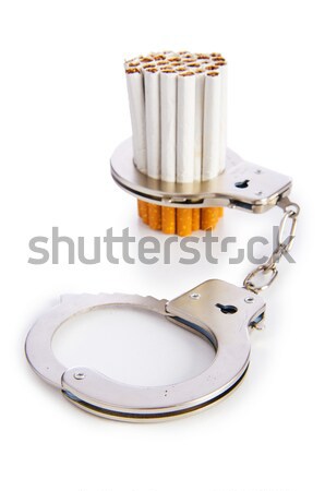 Addition concept with cigarettes and handcuffs Stock photo © Elnur