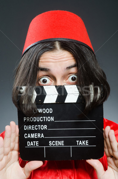 Man wearing red fez hat Stock photo © Elnur