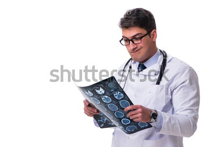 Young male doctor holding a radiograph isolated on white backgro Stock photo © Elnur