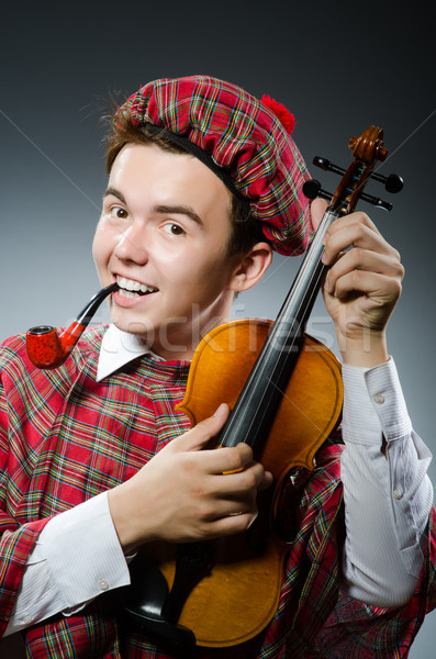 Funny scotsman with violin fiddle Stock photo © Elnur