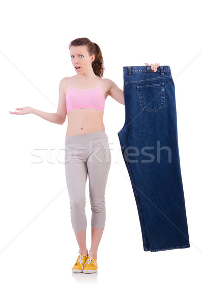 Woman with oversized jeans in dieting concept Stock photo © Elnur