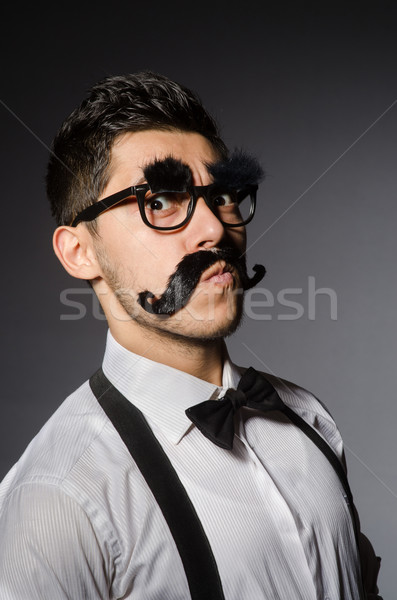 Junger Mann falsch Schnurrbart isoliert grau Modell Stock foto © Elnur