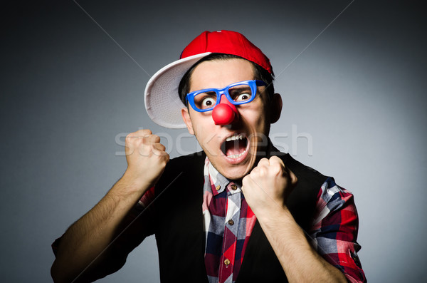 Funny clown against the dark background Stock photo © Elnur