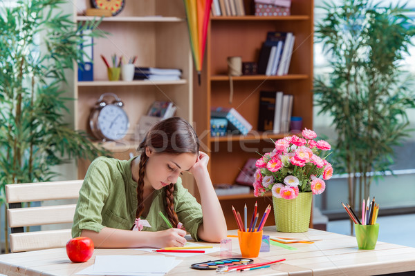 Young girl drawing pictures at home Stock photo © Elnur