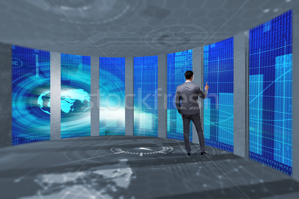 The businessman pressing virtual buttons in futuristic concept Stock photo © Elnur