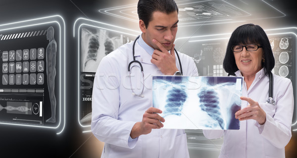 The two doctors looking at x-ray image Stock photo © Elnur