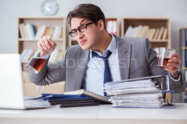 Businessman drinking in the office Stock photo © Elnur