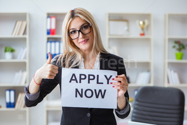 Young businesswoman with message in the office Stock photo © Elnur