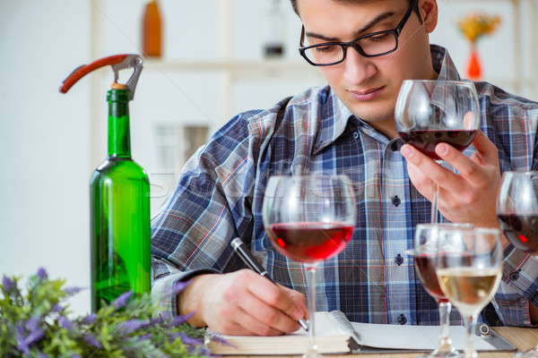Stock photo: Professional sommelier tasting red wine 