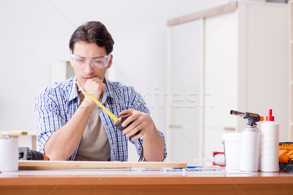 Young man in woodworking hobby concept Stock photo © Elnur
