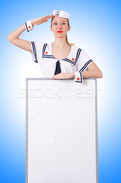 Stewardess with blank board on white Stock photo © Elnur