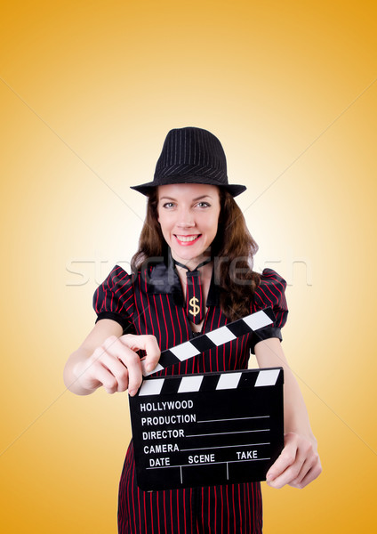 Woman gangster with movie board on white Stock photo © Elnur