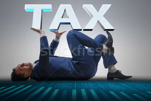 The man under the burden of tax payments Stock photo © Elnur