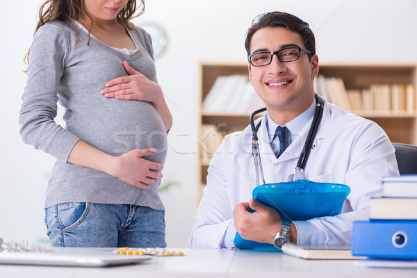 Stock photo: Pregnant woman visiting doctor for consultation