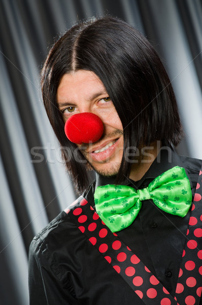 Stock photo:  Funny clown in humorous concept against curtain