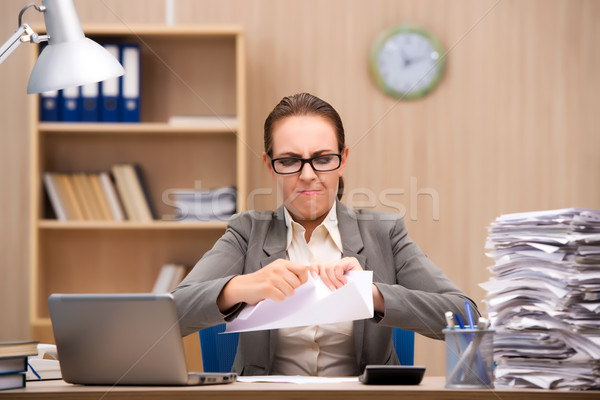 Businesswoman under stress from too much work in the office Stock photo © Elnur