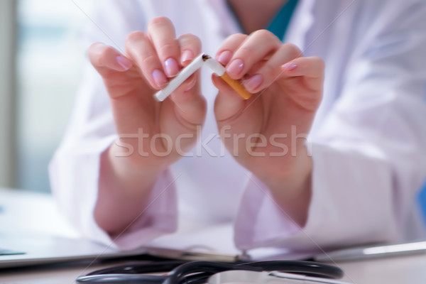 Stock photo: Doctor in anti smoking  concept