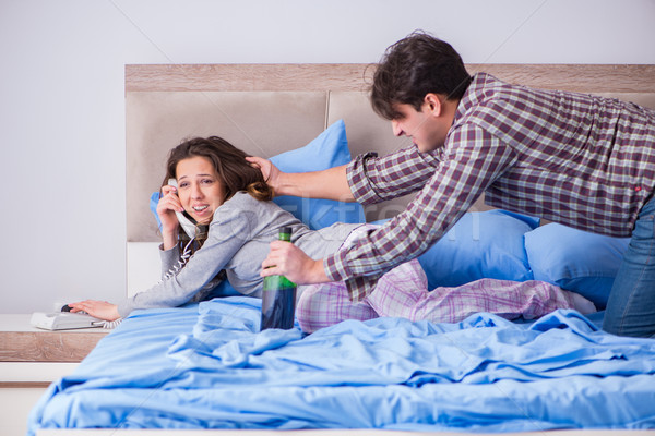 Stock photo: Domestic violence concept in a family argument with drunk alcoho