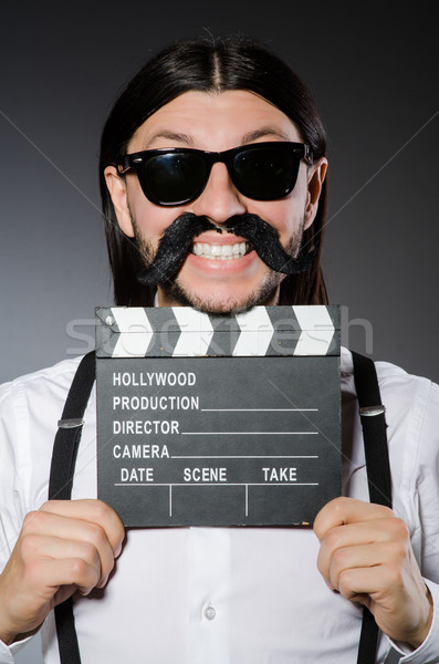 Stock photo: Funny man with movie clapboard