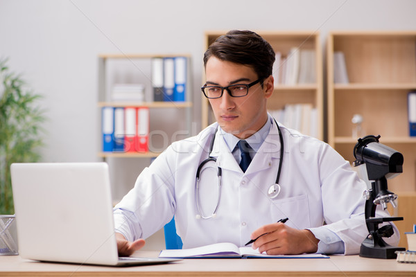 Young adult doctor with laptop computer Stock photo © Elnur