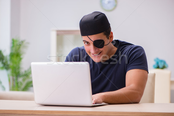 Digital security concept with pirate at computer Stock photo © Elnur