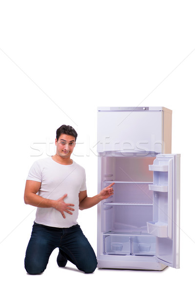 Férfi néz étel üres hűtőszekrény boldog Stock fotó © Elnur