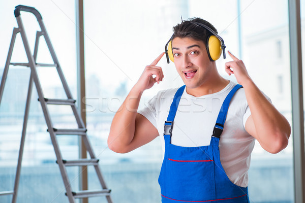 Worker with noise cancelling headphones Stock photo © Elnur