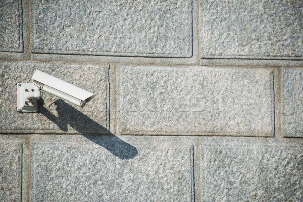 Security camera attached to the wall Stock photo © Elnur