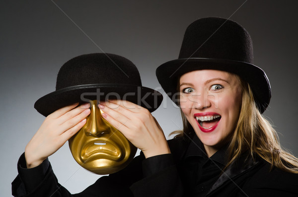 Woman with mask in funny concept Stock photo © Elnur