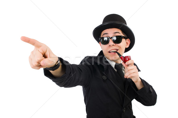 Young detective in black coat holding magnifying glass isolated  Stock photo © Elnur