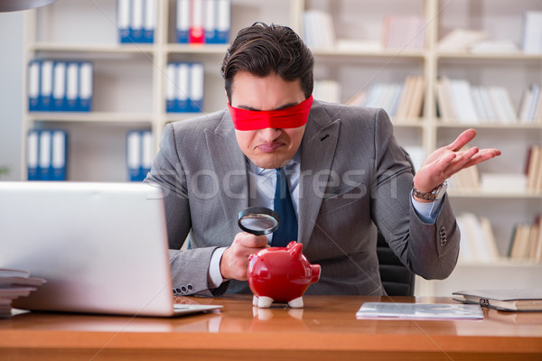 Blindfold businessman sitting at desk in office Stock photo © Elnur