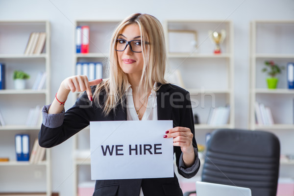 Young businesswoman with message in the office Stock photo © Elnur