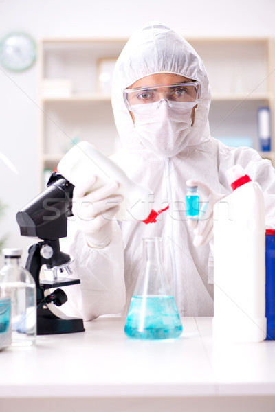 Chemist checking the quality of bathroom supplies Stock photo © Elnur