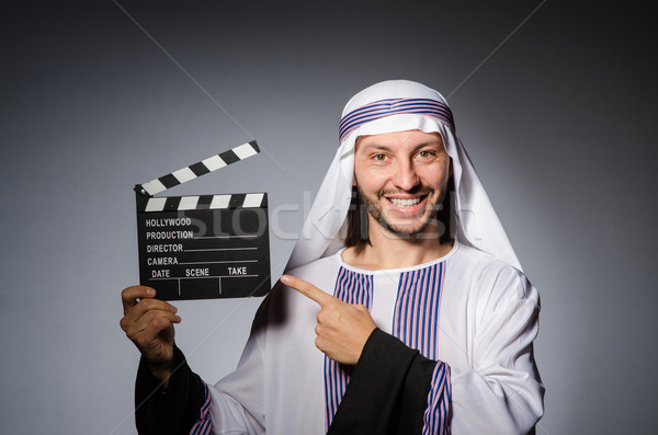 Arab businessman with movie board Stock photo © Elnur