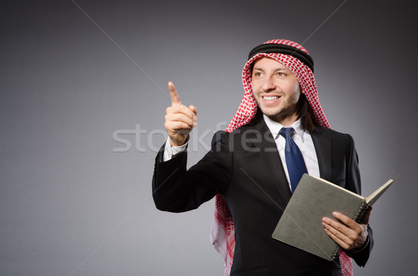 Arab man pressing virtual button Stock photo © Elnur