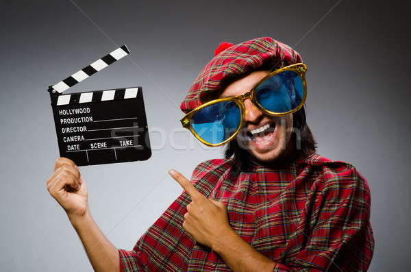 Funny scotsman with movie clapboard Stock photo © Elnur