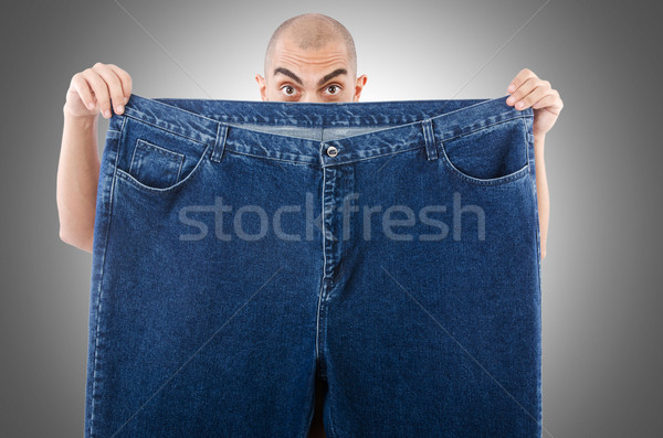 Hombre dieta jeans feliz jóvenes Foto stock © Elnur
