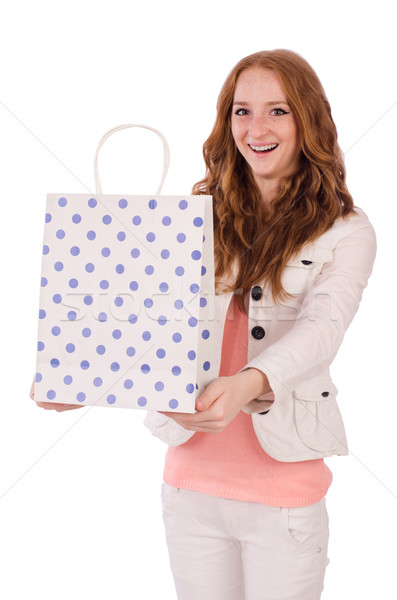 Cute smiling girl in light short coat with plastic bags isolated on white Stock photo © Elnur